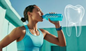 Patient drinking sports drinks, which can contribute to dental erosion and enamel damage