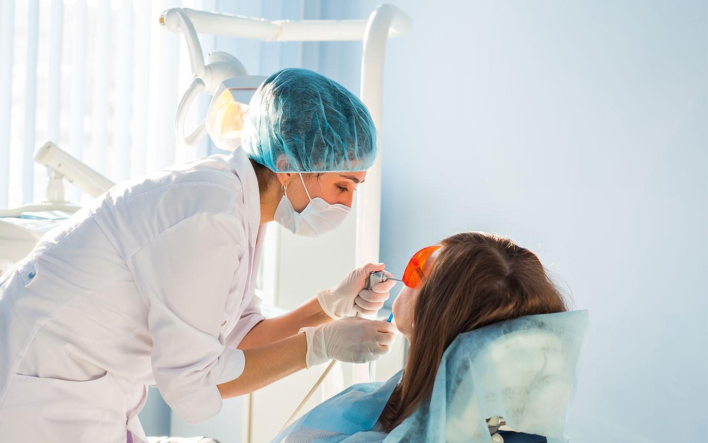 Dentist treating patient using top dental facility in San Jose, California
